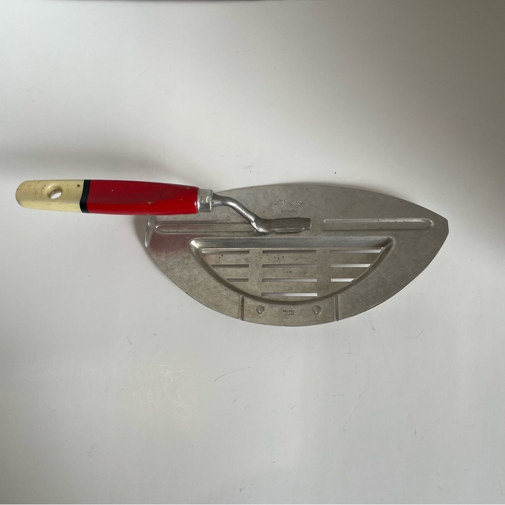 Vintage red wood handle pot strainer collectible